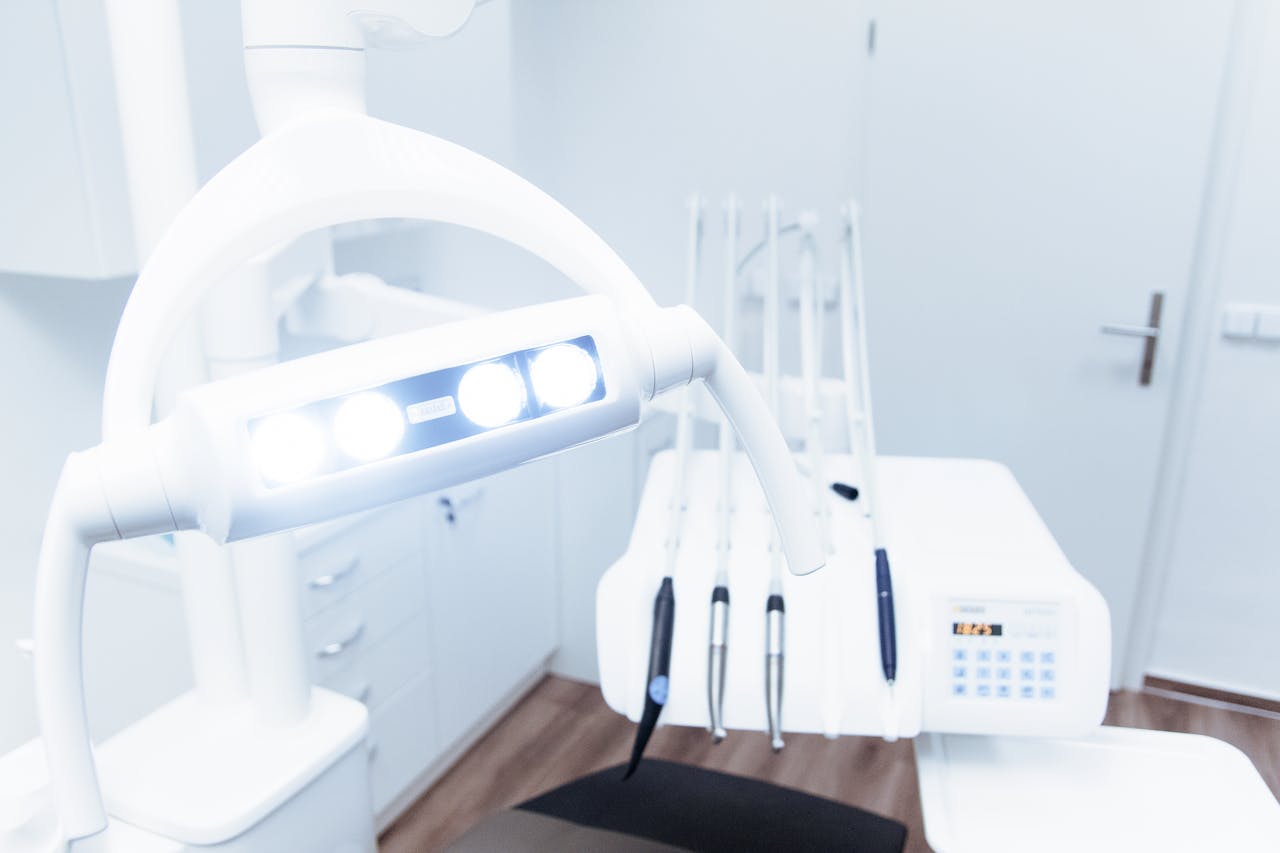home-hero-bg Bright and clean modern dental clinic room with advanced dental equipment.